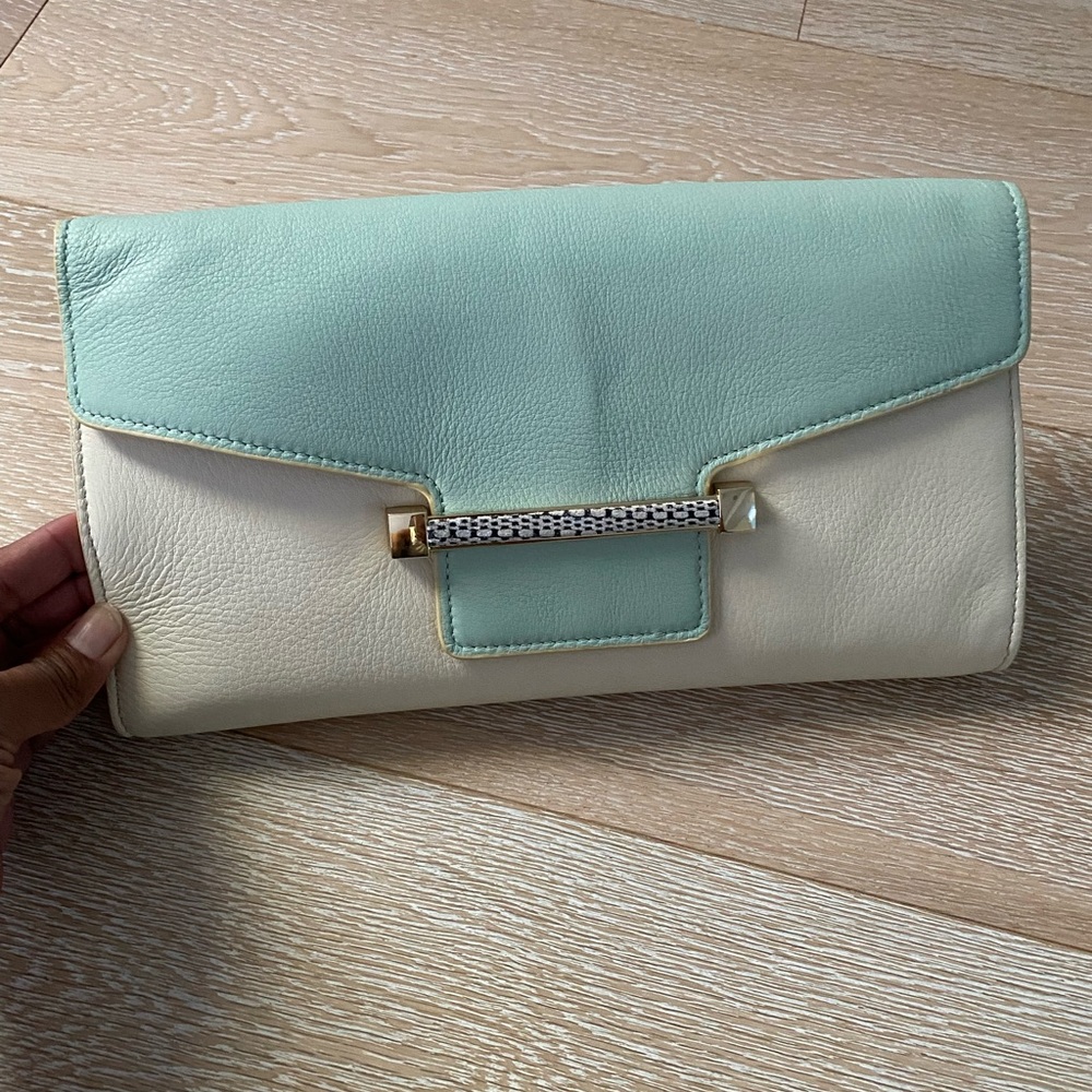 VINCE CAMUTO EUC Cream and light blue leather clutch with magnetic closure.